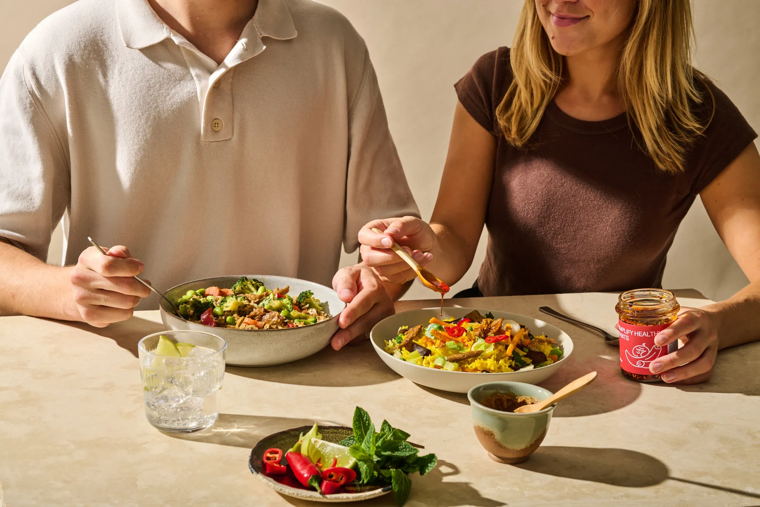 Two people sharing plant-based every meals at a table
